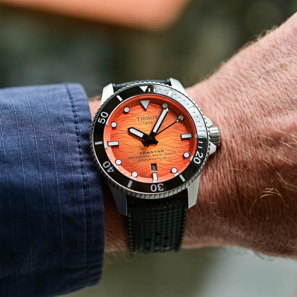 Tissot seastar 2000 professional 44mm cadran portocaliu pe mana